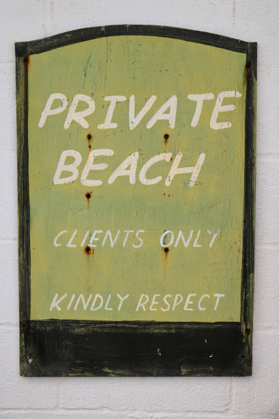 istock Old Decaying Sign for a Hotel Private Beach 1726185794