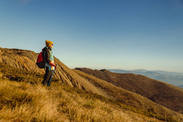 istock Active female hiker enjoying the view from mountain peak 1726189666