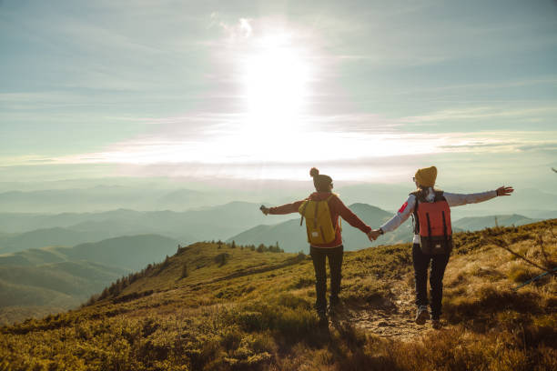 istock Female hikers enjoying the view from mountain peak 1726190829