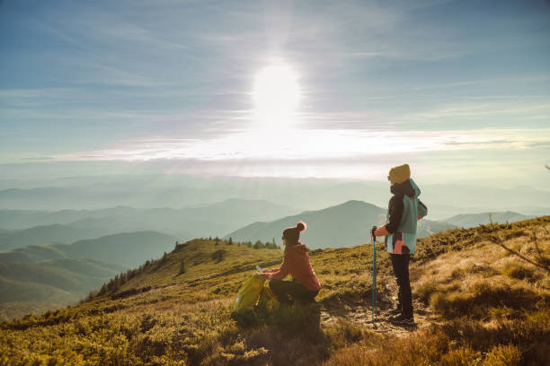 istock Two female hikers enjoying the view from mountain peak on a nice sunny day 1726191920