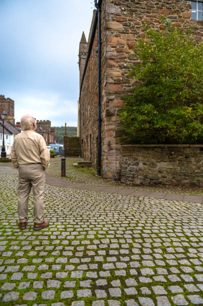 istock Mature man looking up at an old building 1726196767