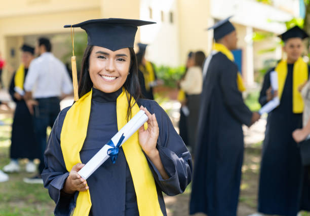 istock Happy student holding her diploma on her graduation day 1726207055