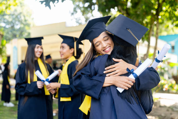 istock Happy graduates hugging and celebrating their graduation 1726207585