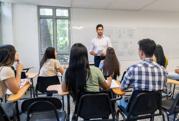 istock Teacher teaching a business class to a group of university students 1726208790