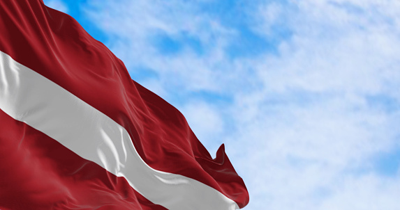 Republic of Latvia national flag waving in the wind on a clear day