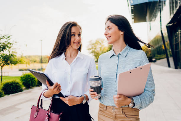 istock Two business women talking while walking outdoors 1726222717