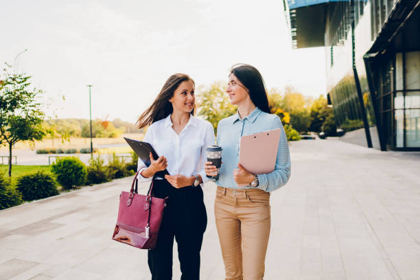 istock Two business women talking while walking outdoors 1726225646