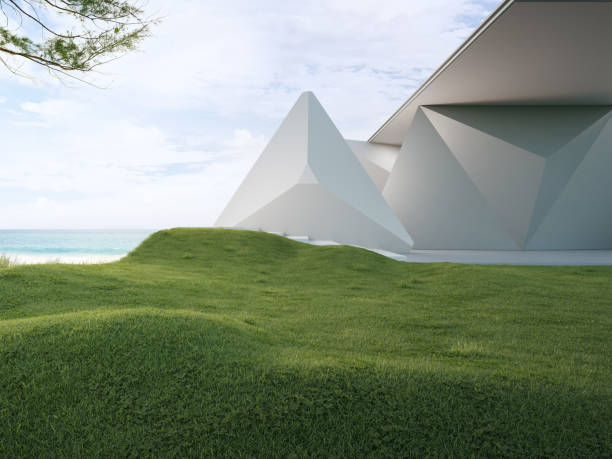istock Geometric shapes structure with gray concrete building on green grass lawn floor. 1726227949