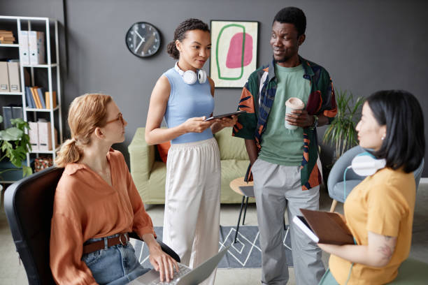 istock Multiethnic young business team brainstorming ideas standing in office 1726237900