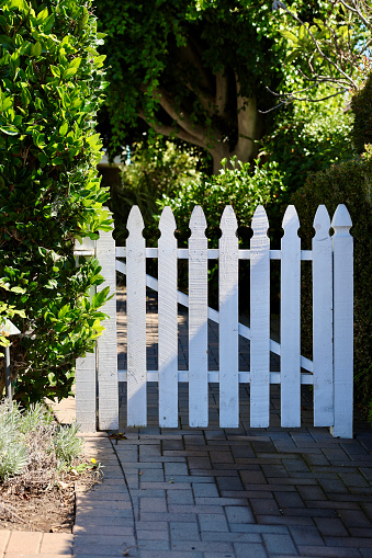 Charming beach cottage with old fashioned white wood garden gate