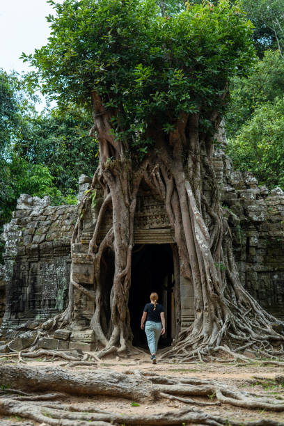 istock Young Redhead Girl Exploring Angkor Wat, Cambodia 1726242109