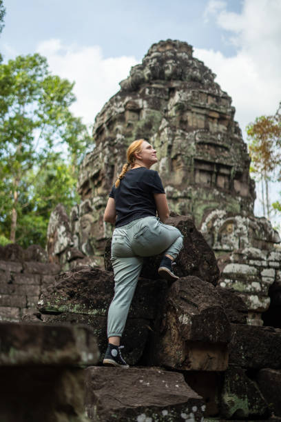 istock Young Redhead Girl Exploring Angkor Wat, Cambodia 1726242830