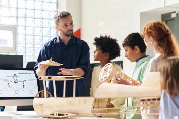 istock Tutor Talking to Group of Children 1726242936