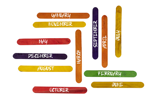 the months of the year written on colored wooden pallets