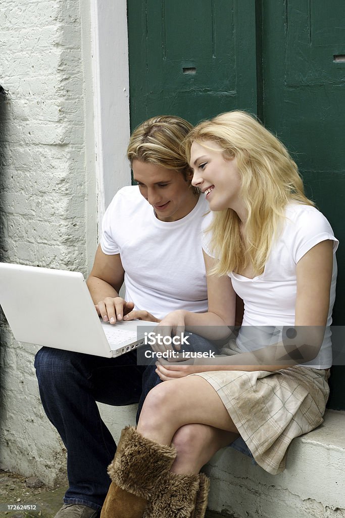 Couples with computer  Adult Stock Photo
