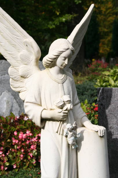 istock white stone angel tombstone 172625369
