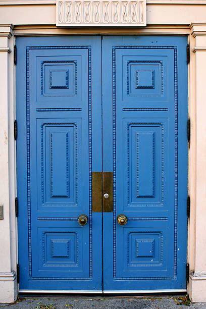 istock Blue residential Doors with brass handles 172625446