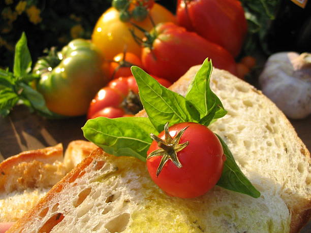 istock Basil & Olive Oil on Bread, Picnic with Organic Heirloom Tomatoes 172625521