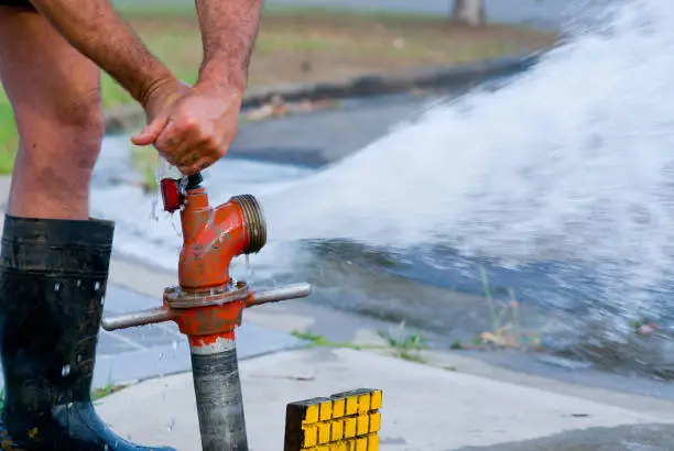 Water gushing from a tap-operated pipe