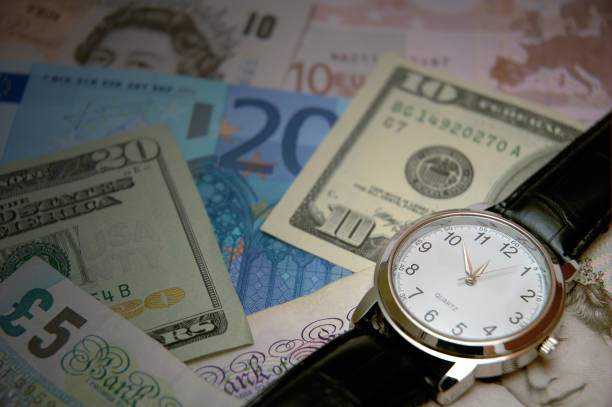 istock Watch and money 172625679