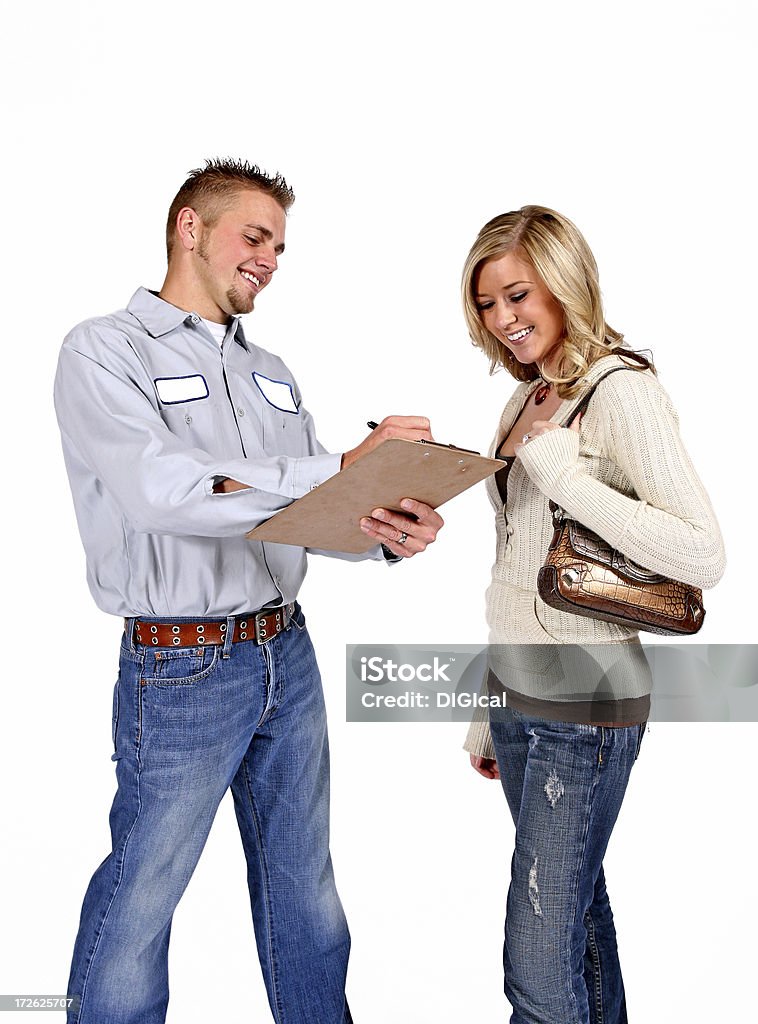 Serviceman "A friendly service person, mechanic, plumber, electrician, cable guy,with a female customer, etc... Add your company logo to the blank patch on the shirt." Customer Stock Photo