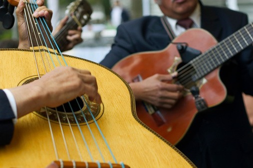 traditional mexican trio of guitar players