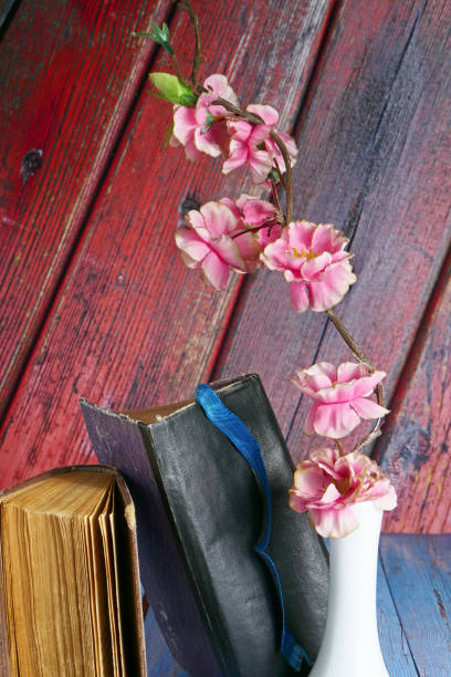 istock still life with artificial flowers and old books on the table 1726260354