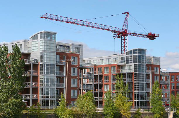 istock Crane over a Modern Residential Construction 172626293