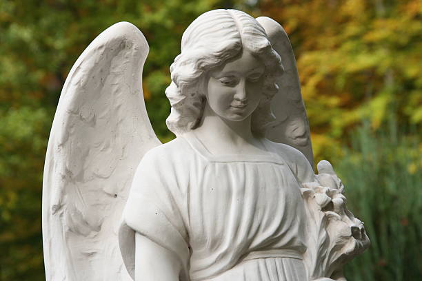istock white tombstone angel on a grave 172626325