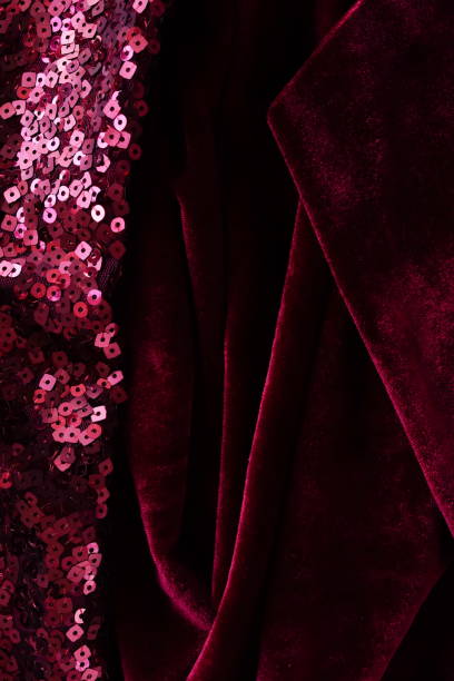 istock Velvet texture dark red color with sparkles Sequins fabric texture background with copy space. Expensive luxury fabric,  wallpaper. Holiday, Christmas backdrop. 1726263811