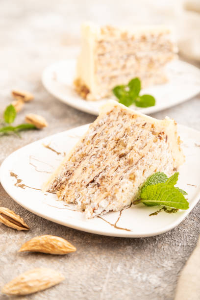 istock Walnut and almond cake on brown concrete, side view, selective focus. 1726266656
