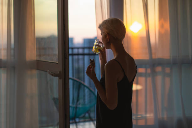 istock Woman looking out the window. Morning 1726266677