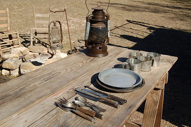Chuck Wagon Table Table set ready to serve supper. chuck wagon stock pictures, royalty-free photos & images