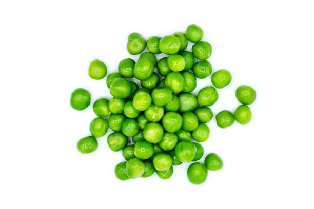 istock Green peas isolated on white background top view 1726269560