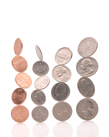 Balanced Coins on White Background.