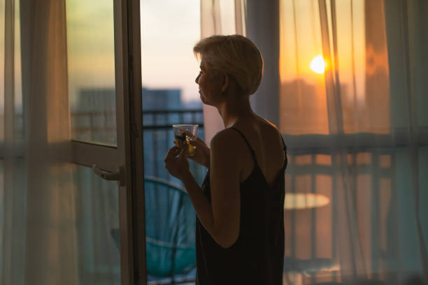istock Woman looking out the window. Morning 1726270676
