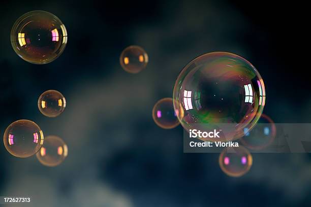 Soap Bubbles Floating In Front Of A Dark Background Stock Photo - Download Image Now