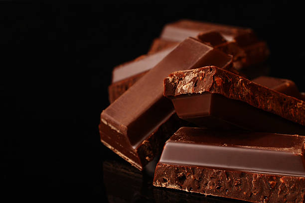 istock Close up of broken bits of dark chocolate bars 172627842