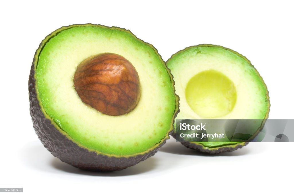 Aguacate mitades Pit frontal - Foto de stock de Aguacate libre de derechos