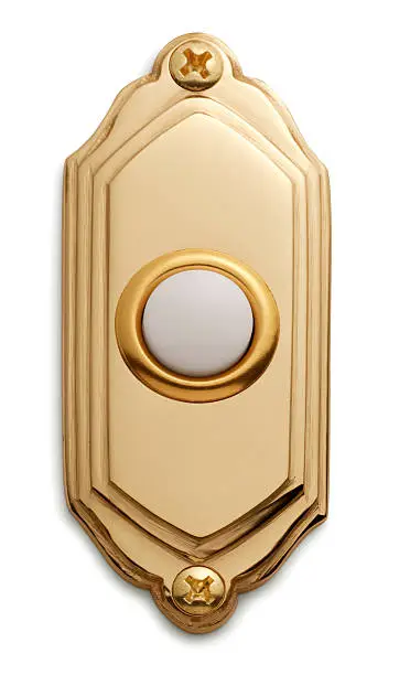 Golden doorbell on white with soft shadow