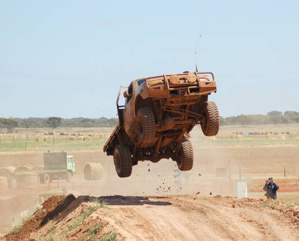 offroad racing 4x4 vehicle jumping an obstacle hopper car stock pictures, royalty-free photos & images