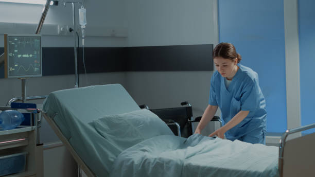 istock Caucasian nurse making hospital ward bed for use 1726290208