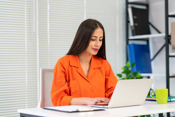 istock Woman Using Laptop Working Online Sitting In Office 1726290215