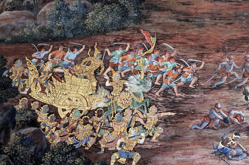 Bangkok, Thailand, December 27, 2018. A traditional Thai mural painting depicting a battle scene. Mythical plots of the ancient Indian epic in the wall painting of a Thai temple.