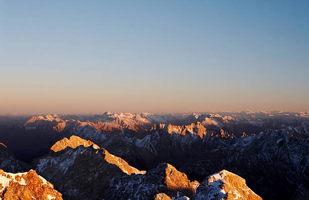 A panoramic view of the snow capped Wetterstein mountains from on top zugspitze in Garmisch-Partenkirchen Germany.