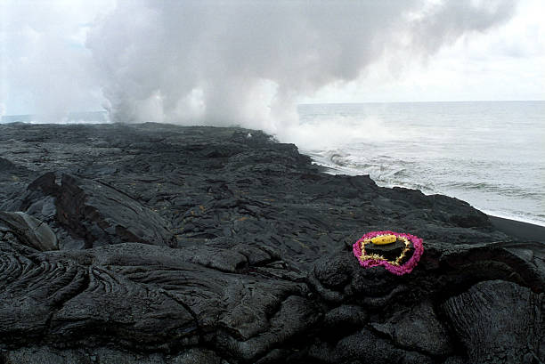 Kīlauea pele erupting at the Hawaii volcanoes national park. Kīlauea is a currently active shield volcano in the Hawaiian Islands, and the most active of the five volcanoes that together form the island of Hawaiʻi. Located along the southern shore of the island, the volcano is between 300,000 and 600,000 years old and emerged above sea level about 100,000 years ago.
