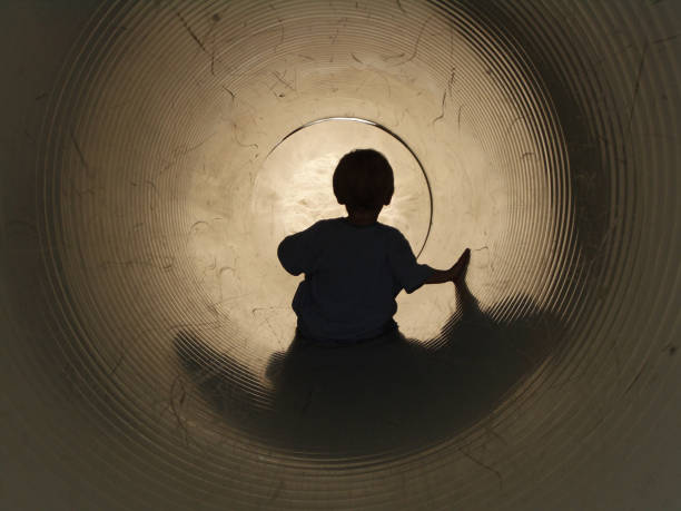 istock Boy on Slide: At The End of a Tunnel 172629656