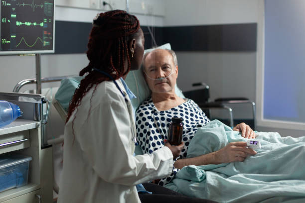 istock Senior man breathing with help from oxygen tube 1726318944