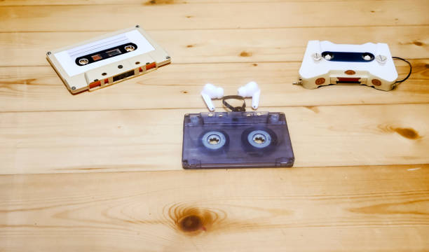 istock retro cassettes, cassette player and modern headphones 1726320528