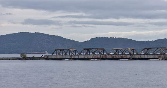 railway bridge trestle along the hudson river (near croton river confluence) rail, train, tracks, water, iron bars, dusk, sunset, blue hour, hudson valley update new york